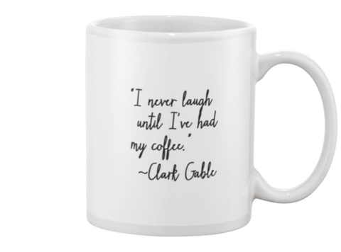 "I never laugh until I have had my coffee" Mug